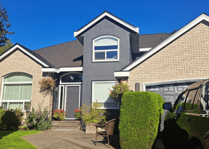 an exterior paint job completed by Grade A Painters ontop of stucco